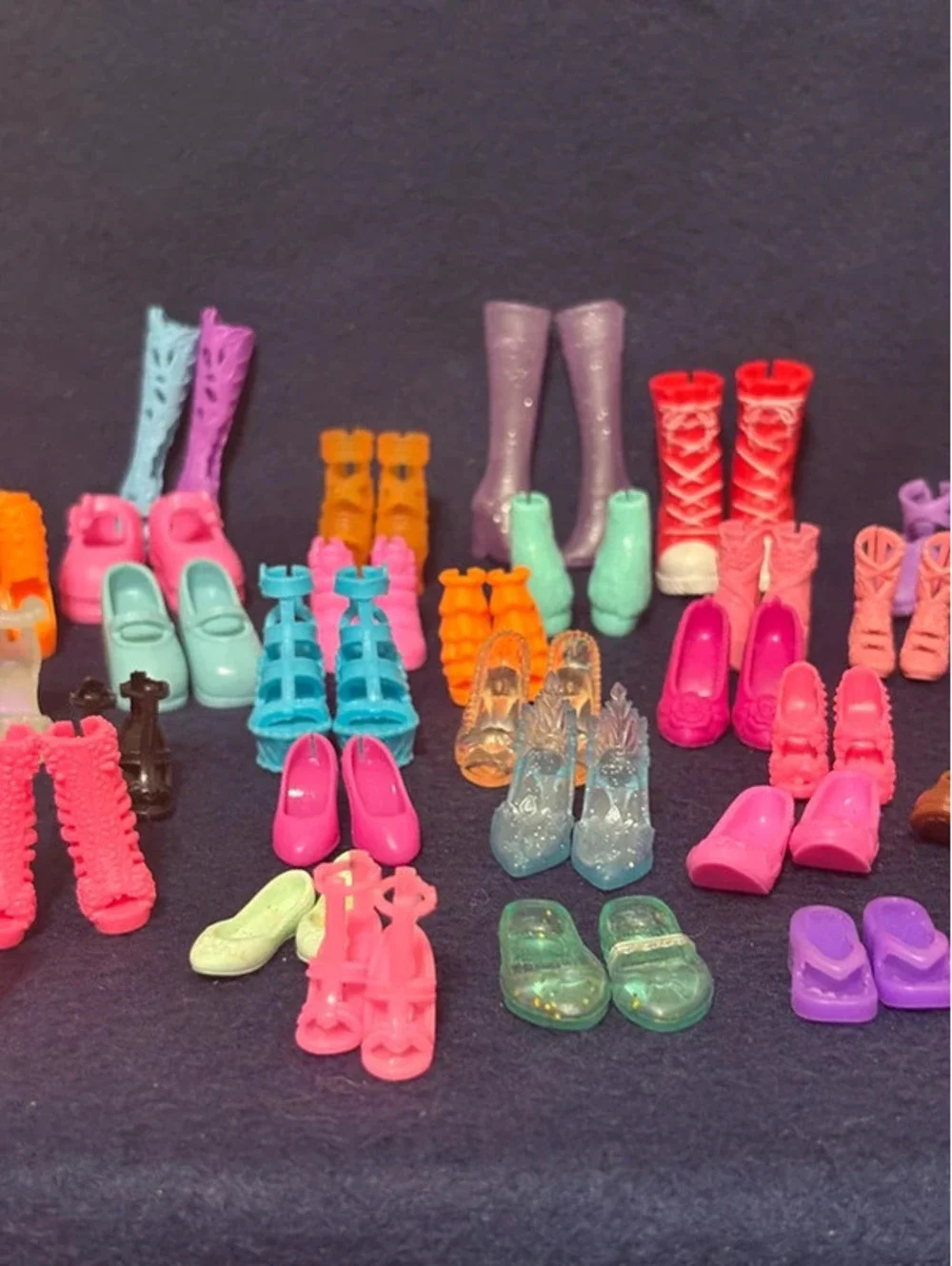 46 Matching pair of small dolls, Barbies, and Ken shoes